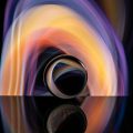 Crystal ball on board near abstract shines