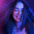 woman-colorful-portrait-girl-playing-with-hair-2025-03-18-19-17-43-utc_11zon