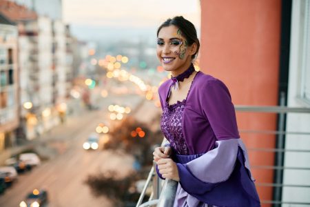 happy-woman-in-carnival-costume-looking-at-mardi-g-2024-12-13-20-25-50-utc