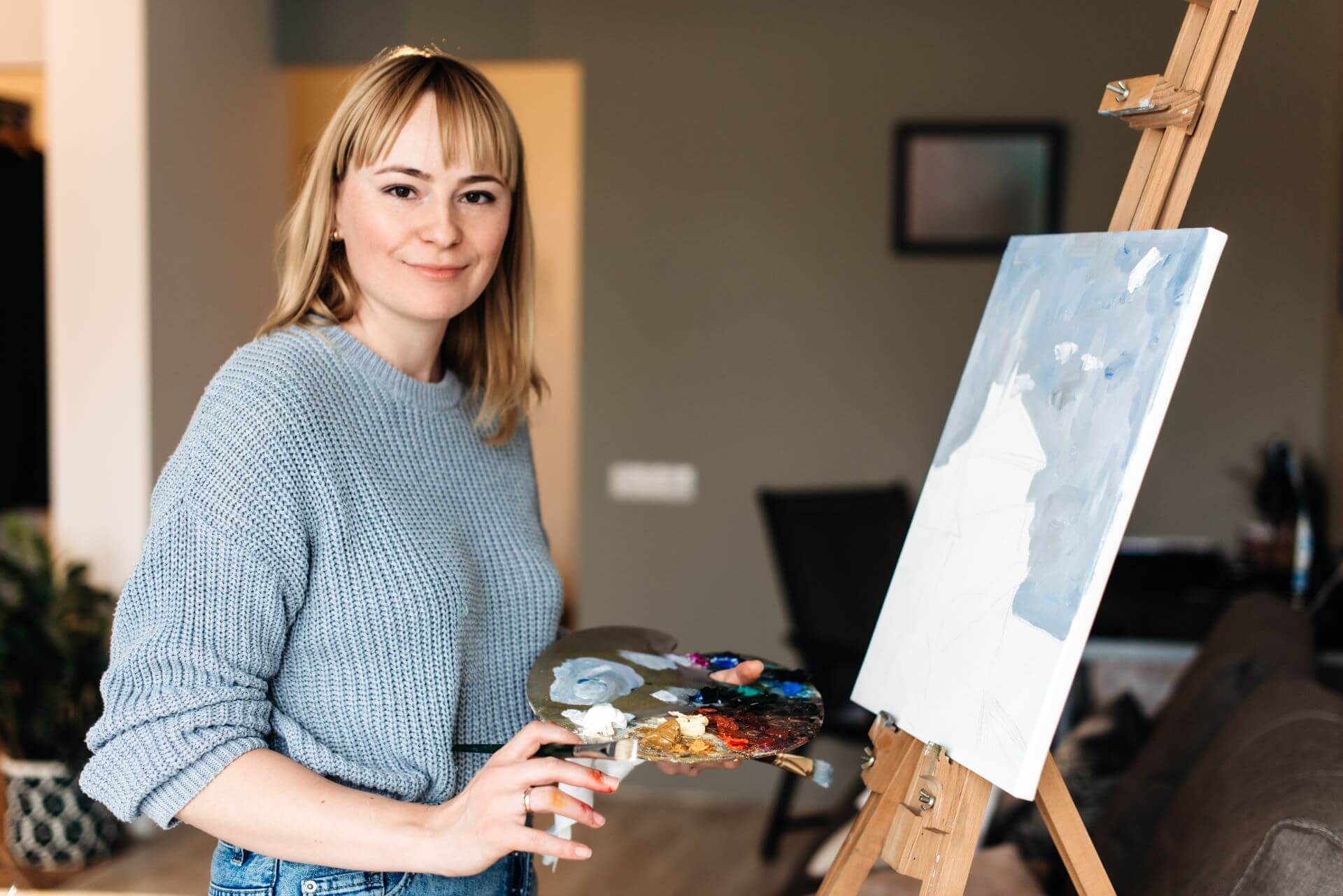 portrait-of-a-happy-artist-with-a-palette-in-hands-2024-10-18-08-55-40-utc