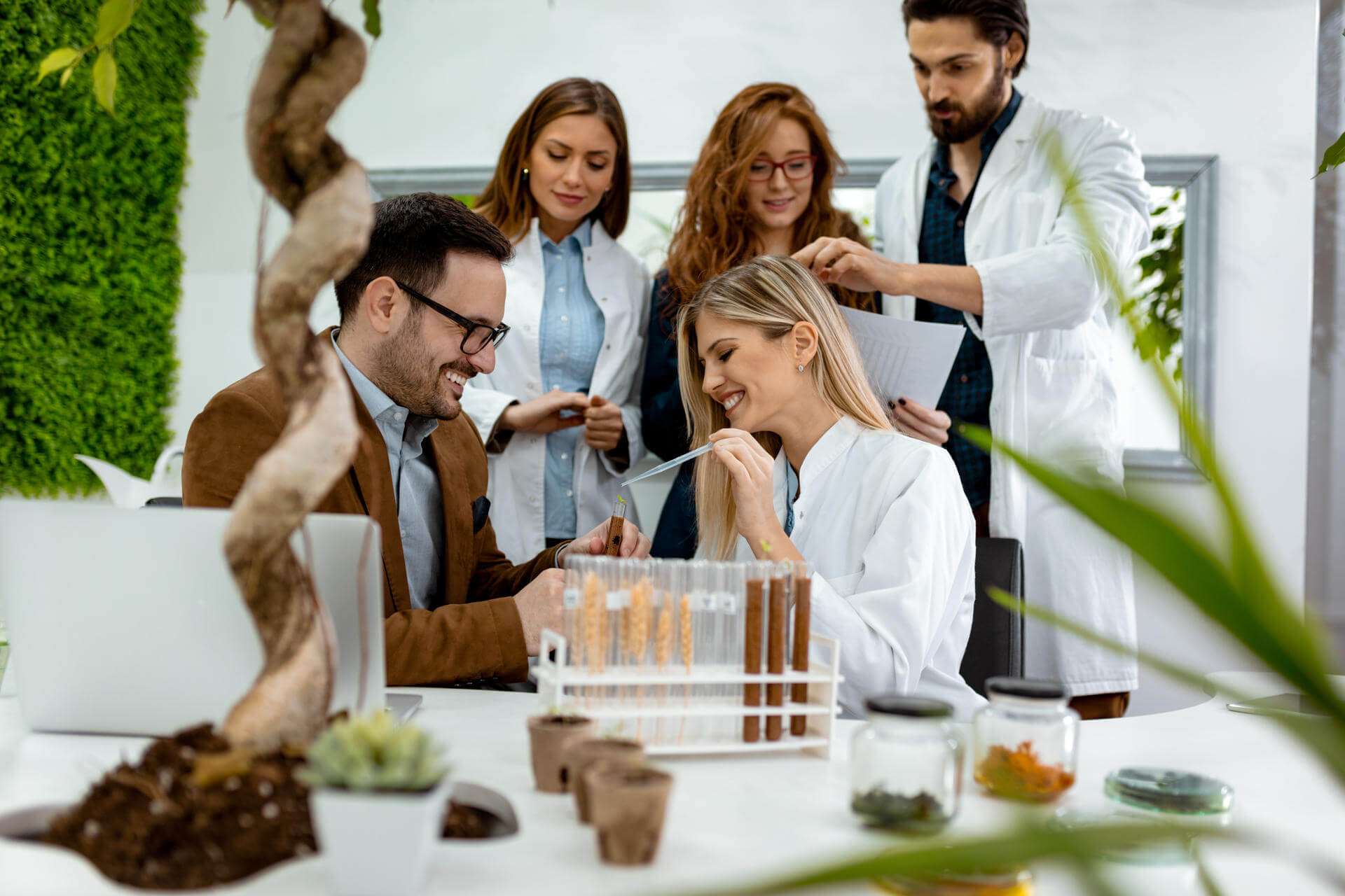 scientist-examining-samples-with-plants-2024-10-22-14-58-45-utc