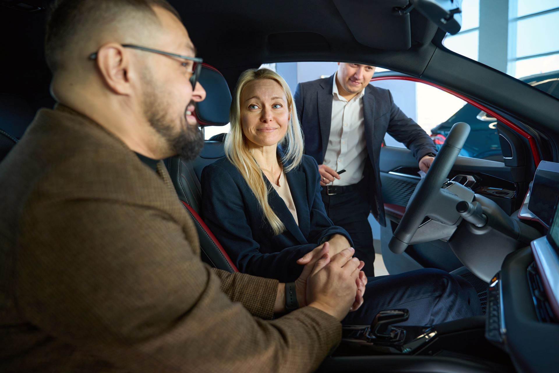 smiling-wife-driving-while-looking-at-her-husband-2025-03-06-02-42-32-utc