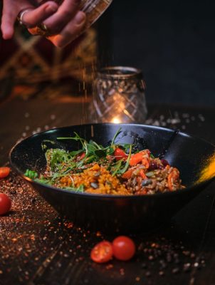 cooked-vegetarian-bowl-of-plov-on-a-wooden-table-2025-01-25-01-22-52-utc