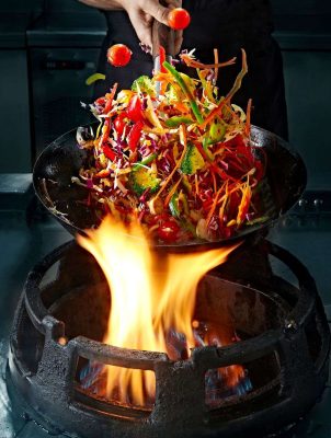 crop-hand-cooking-vegetable-wok-on-pan-2023-11-27-05-36-31-utc_11zon