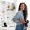 Photography Career. Female Photographer Posing Holding Photocamera Smiling Looking At Camera Standing In Modern Studio Indoors. Creative Professions And Photo Art Concept