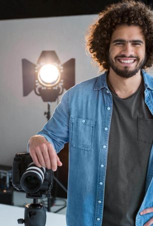 happy-male-photographer-standing-in-studio-2025-04-04-11-20-04-utc