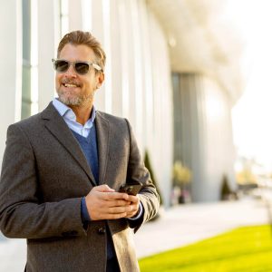 confident-businessman-enjoys-a-sunny-afternoon-whi-2025-04-22-01-18-40-utc confident-businessman-enjoys-a-sunny-afternoon-whi-2025-04-22-01-18-40-utc