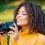 young-pretty-african-woman-in-yellow-takes-picture-2023-11-27-05-00-24-utc_11zon