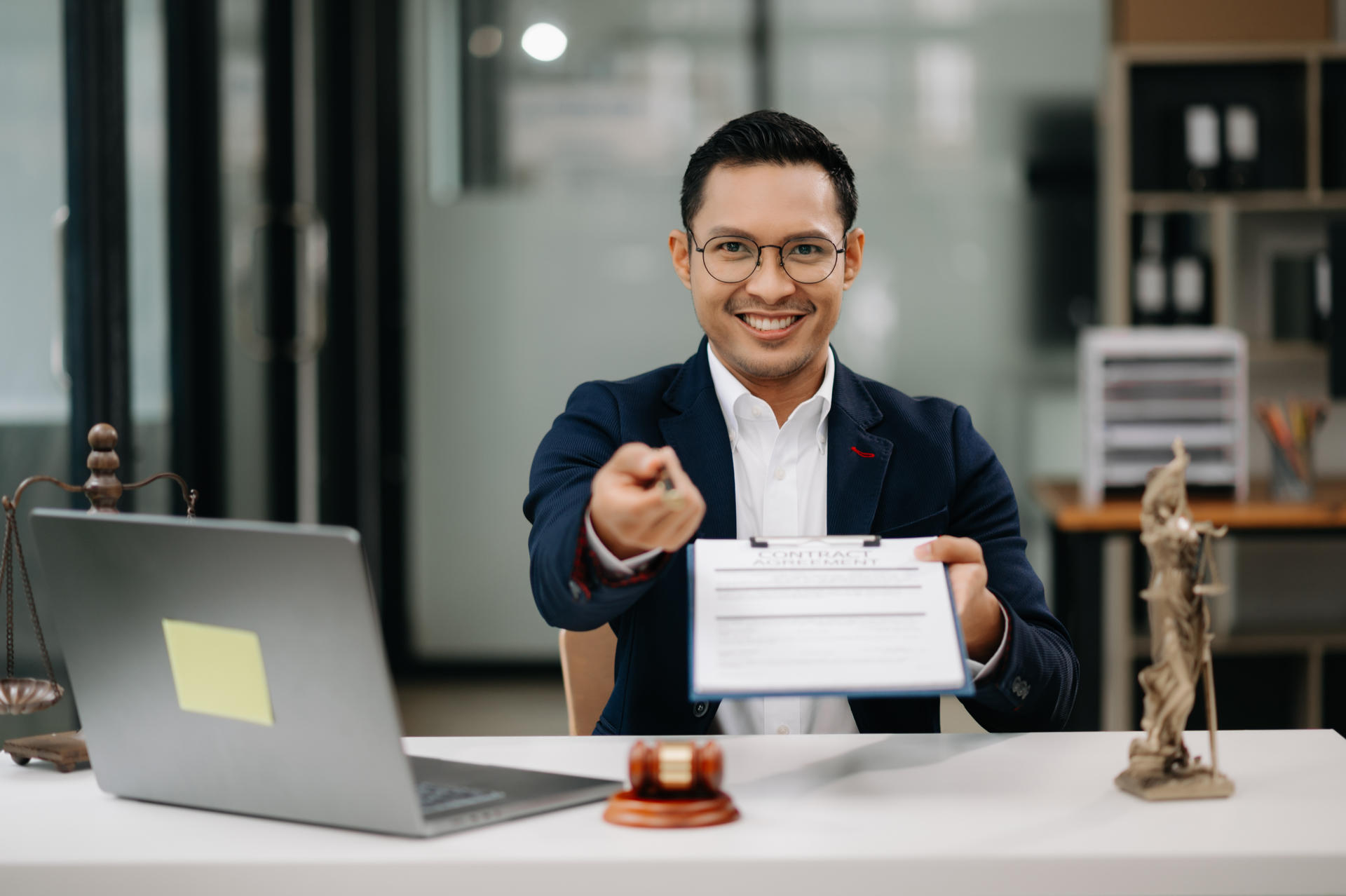 justice and law concept .Asian Male judge in a courtroom on table and Counselor working in office.