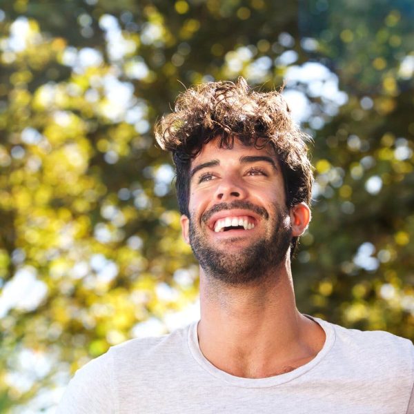 close-up-laughing-handsome-man-with-beard-outside-2024-10-16-03-52-28-utc