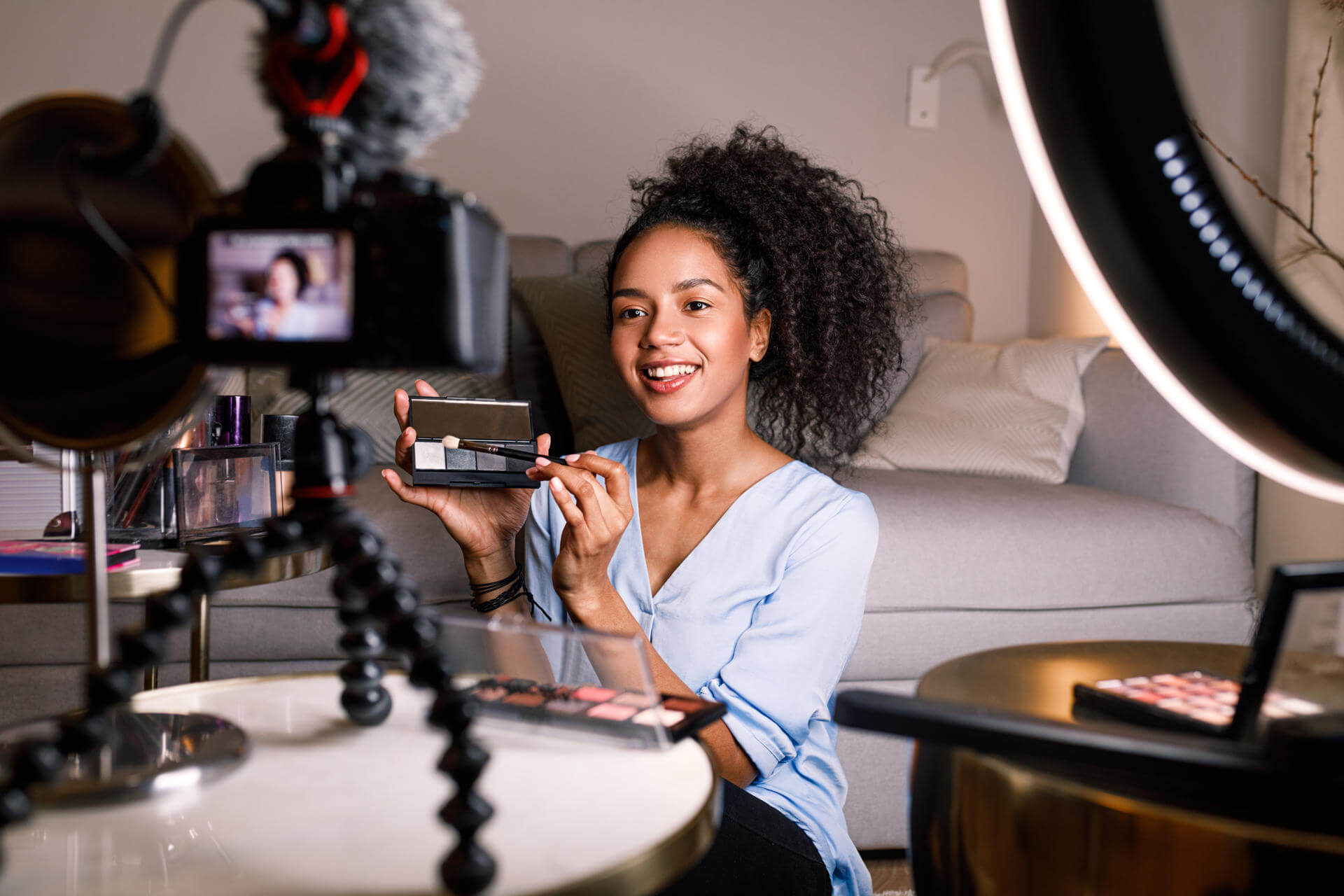 smiling-woman-holding-a-makeup-palette-while-recor-2025-03-06-14-38-39-utc smiling-woman-holding-a-makeup-palette-while-recor-2025-03-06-14-38-39-utc