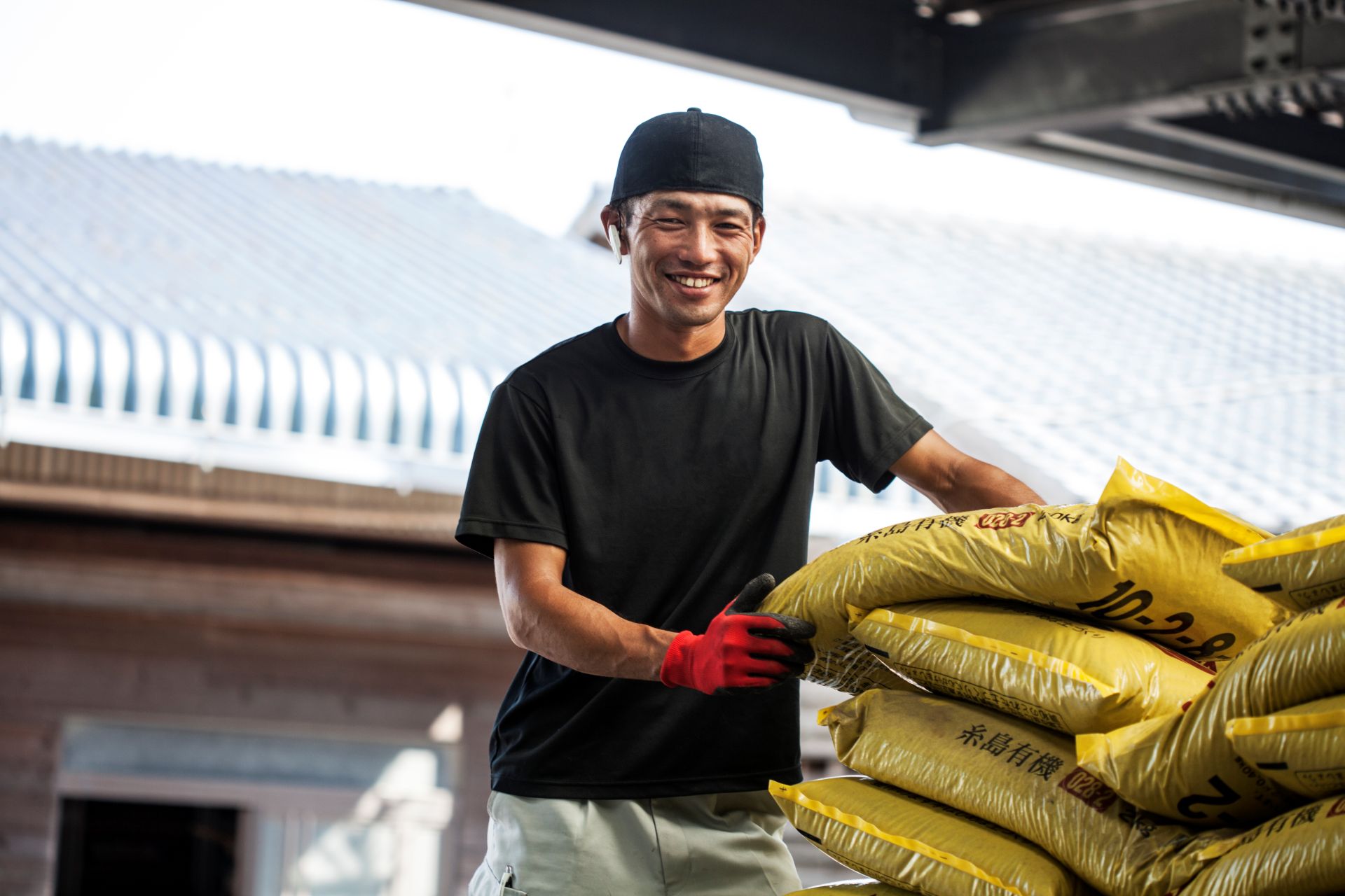 japanese-farmer-wearing-black-cap-standing-next-to-2023-11-27-04-57-35-utc