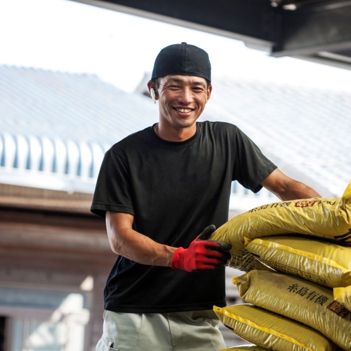 japanese-farmer-wearing-black-cap-standing-next-to-2023-11-27-04-57-35-utc