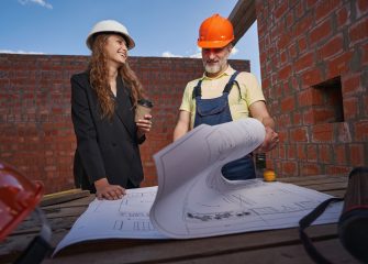 joyful-woman-smiling-at-worker-during-bluepring-ex-2023-11-27-05-10-52-utc