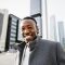 Happy African man in capital business city center Happy African man in capital business city center