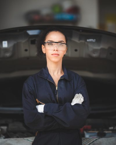 professional African American mechanic woman portrait, auto car repair and service workshop professional African American mechanic woman portrait, auto car repair and service workshop service job by adult African female technician person in industry of engine or vehicle occupation automobile
