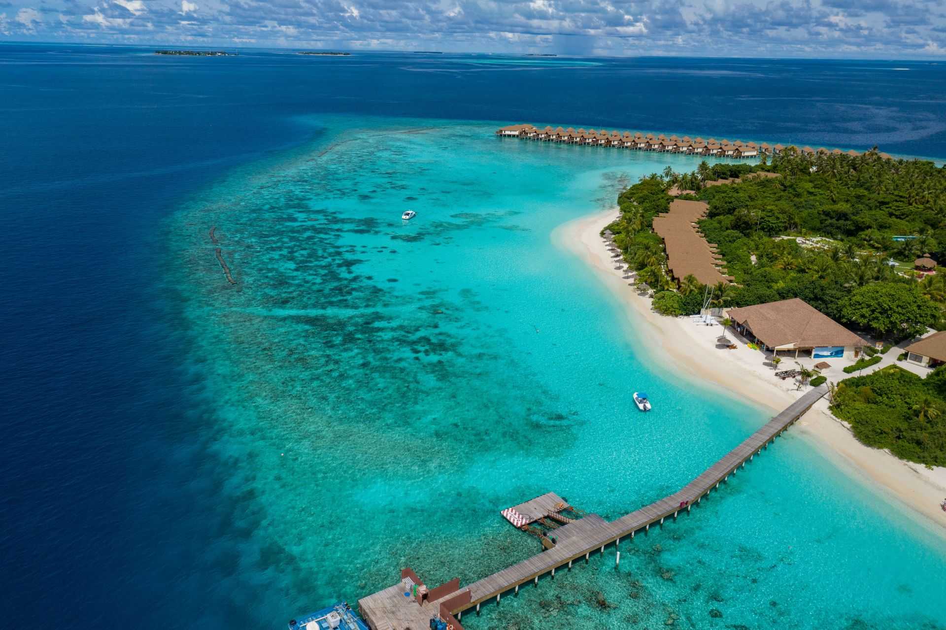 aerial-view-of-a-tropical-island-and-a-wooden-jett-2023-11-27-05-05-36-utc_11zon