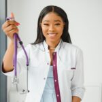 portrait-of-smiling-female-doctor-wearing-white-co-2024-02-27-21-39-09-utc