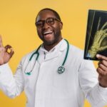 smiling-african-american-doctor-holding-x-ray-pict-2024-10-30-17-05-37-utc